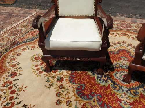 Pair of Beautifully carved  imbuia Ball and Claw Single Seaters armchairs good condition