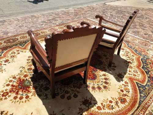 Pair of Beautifully carved  imbuia Ball and Claw Single Seaters armchairs good condition