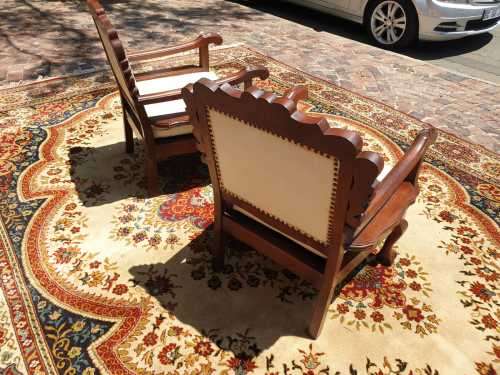 Pair of Beautifully carved  imbuia Ball and Claw Single Seaters armchairs good condition