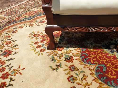 Pair of Beautifully carved  imbuia Ball and Claw Single Seaters armchairs good condition