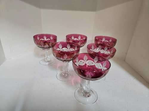 A rare set of six red cut to clear champagne glasses or coupes