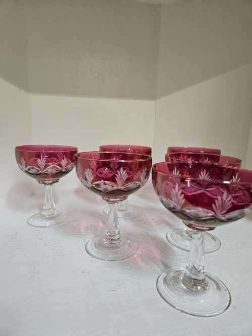 A rare set of six red cut to clear champagne glasses or coupes