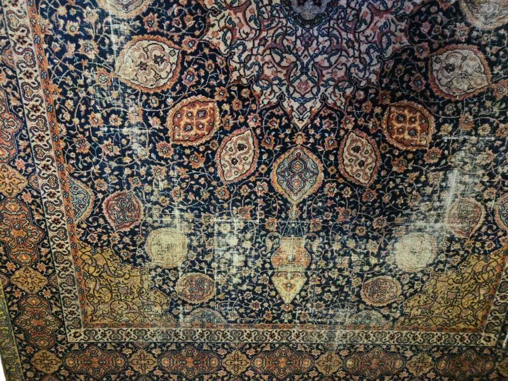 Add some vintage charm to your home with our very large worn Persian style machine-made carpet