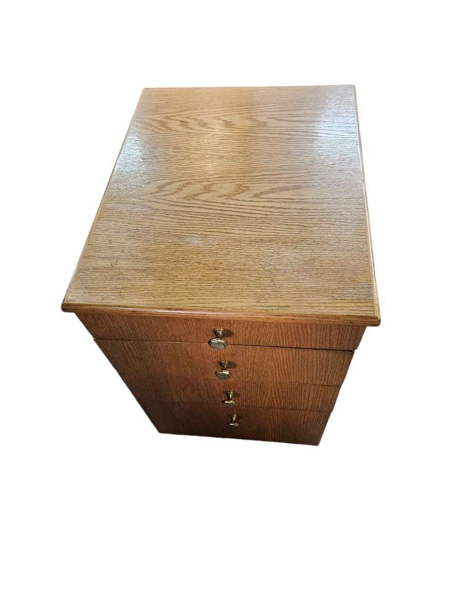 Elevate your office or bedside with this  Oak Finished set of drawers on casters,