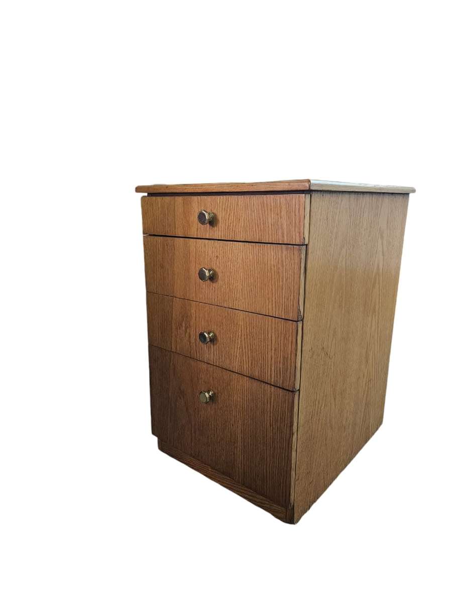 Elevate your office or bedside with this  Oak Finished set of drawers on casters,