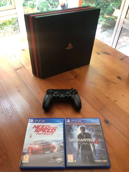 PlayStation 4 Pro + Controller + two games including cables + D-brand skin for R6000