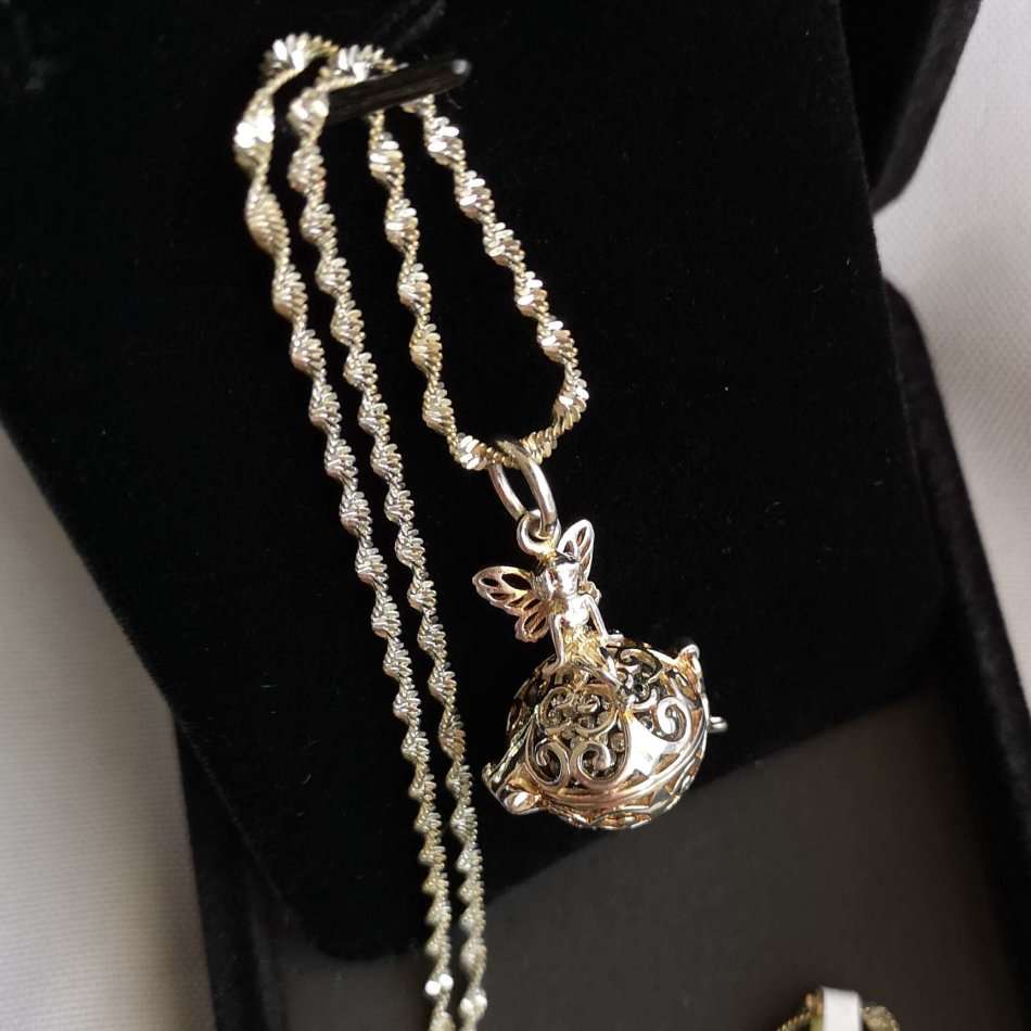 Beautiful Twisted Sterling Silver Necklace with Angel Pendant Locket holding a tiny Crystal Ball