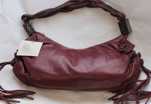 GENUINE JENNIFER LOPEZ (JLO) BURGUNDY ORIGINAL LEATHER 'HOBO' HANDBAG WITH TASSEL DETAILS.