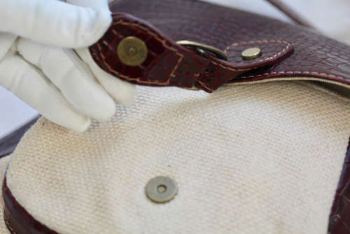 PAUL COSTELLOE DRESSAGE SADDLEBAG HANDBAG. CREAM FABRIC WEAVE WITH BURGUNDY PATENT LEATHER DETAILS