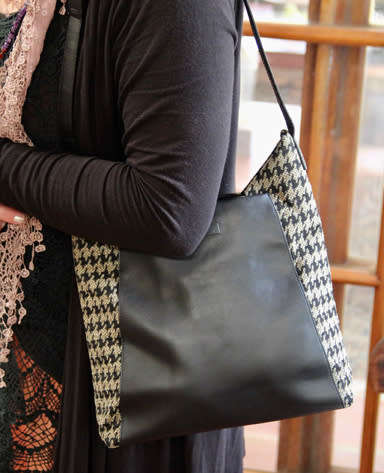 TUMI LEATHER AND HOUNDSTOOTH WOOL BUCKET HANDBAG. QUITE RARE! DUSTCOVER.