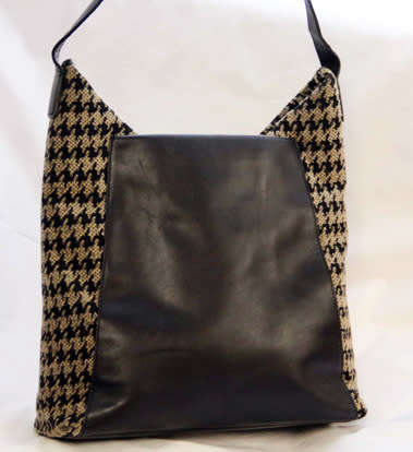 TUMI LEATHER AND HOUNDSTOOTH WOOL BUCKET HANDBAG. QUITE RARE! DUSTCOVER.