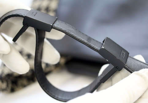 TUMI LEATHER AND HOUNDSTOOTH WOOL BUCKET HANDBAG. QUITE RARE! DUSTCOVER.