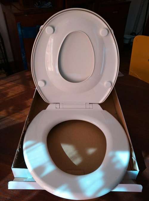 Standard toilet seat with built in child seat