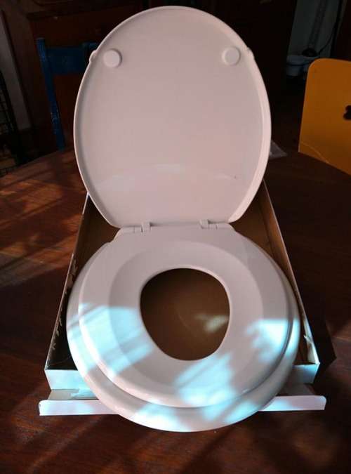 Standard toilet seat with built in child seat
