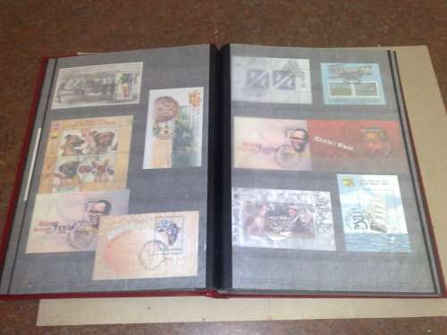 GOOD LIGHTHOUSE 16 PGE STOCKBOOK,HALF FILLED WITH RSA,MINISHEETS ETC,CTO LOT