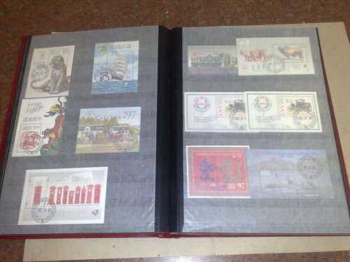 GOOD LIGHTHOUSE 16 PGE STOCKBOOK,HALF FILLED WITH RSA,MINISHEETS ETC,CTO LOT