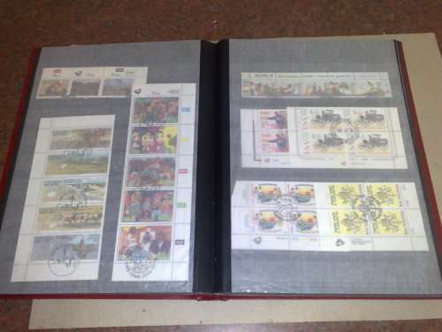 GOOD LIGHTHOUSE 16 PGE STOCKBOOK,HALF FILLED WITH RSA,MINISHEETS ETC,CTO LOT