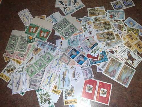 RHODESIA-CLEARANCE LOT-100 BLOCKS OF 4,PLUS APP 200 PLUS UM,SINGLES,PAIRS ETC-GOOD VALUE