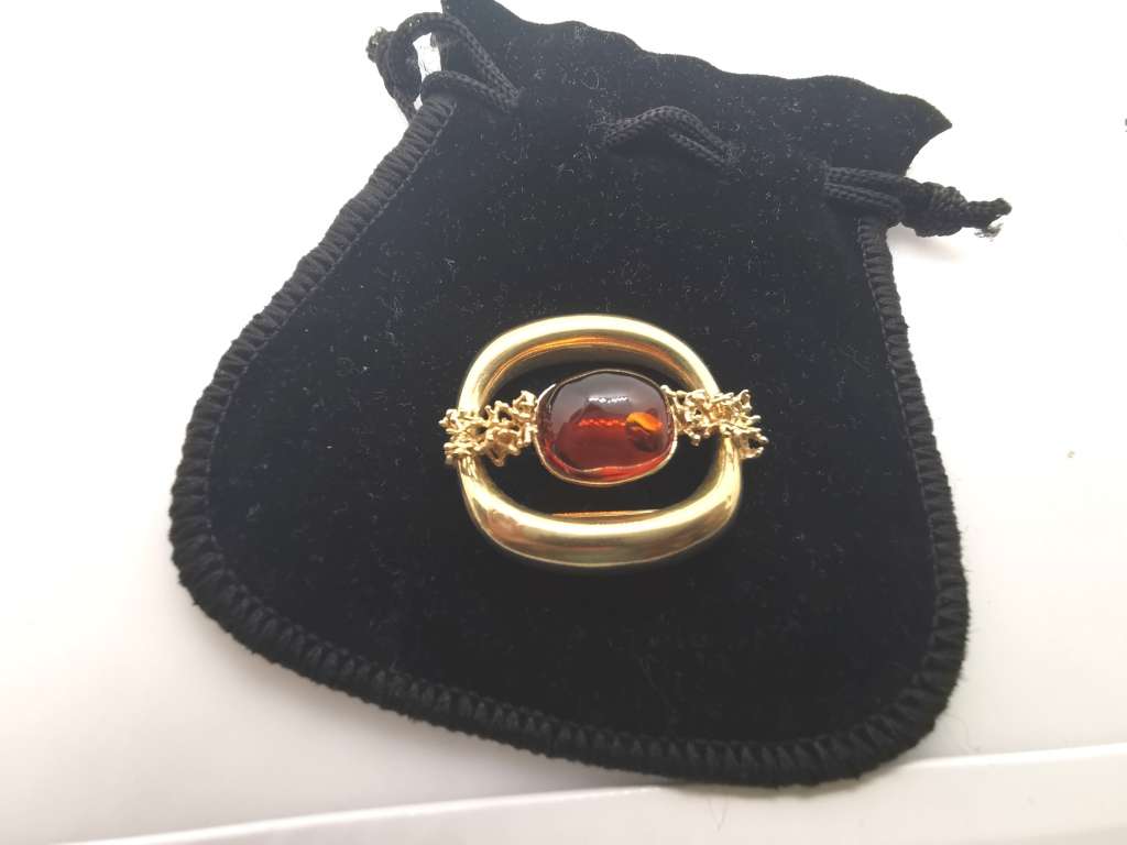 Vintage gold brooch set with amber