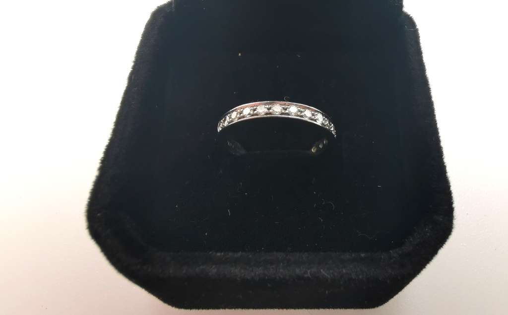 White gold and diamond half eternity ring