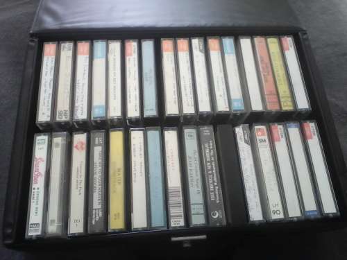 32 Assorted Tapes + Carry Case (Sold as one Lot)