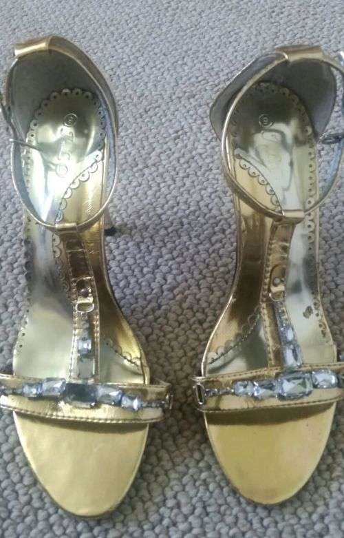 Gold high heel sandles