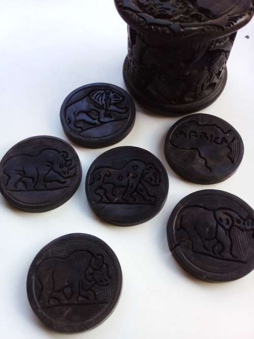 Coasters and Coaster holder from Africa, hand made. Hard wood.