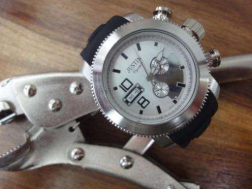 Georgous Justin watch. Chunky metal finish.