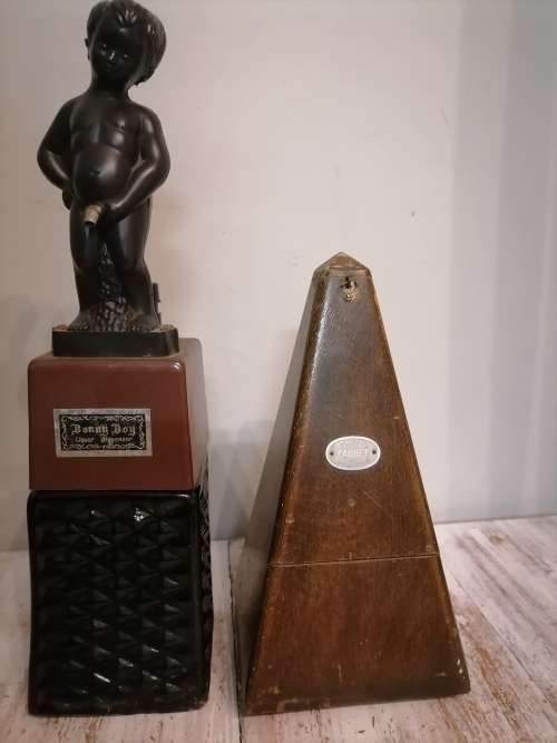 Vintage Piano Metronome and vintage liquor dispenser