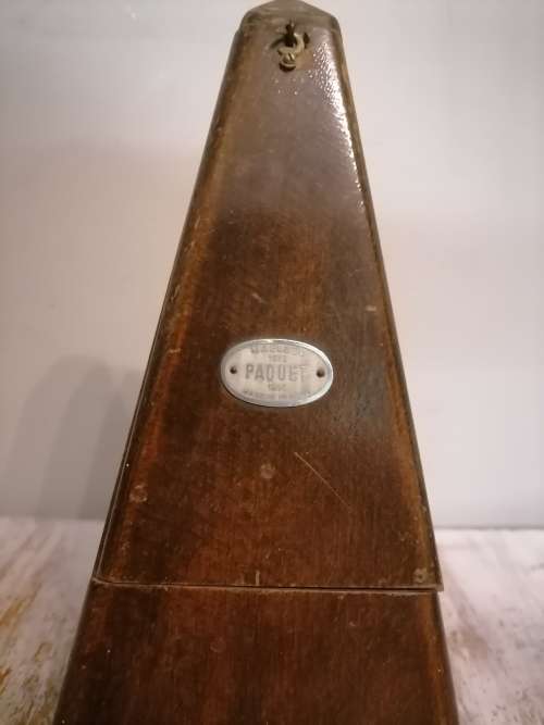 Vintage Piano Metronome and vintage liquor dispenser