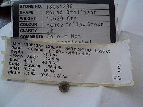 1.620 cts ROUND BRIALLIANT CUT DIAMOND FANCY YELLOW BROWN WITH CERTIFICATE.