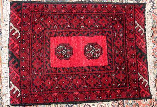 A beautiful small hand-knotted Afghan Oriental rug