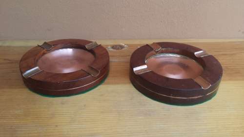Lovely pair of old wood and copper ashtrays.