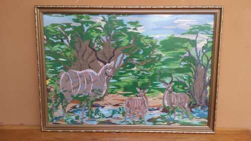 Beautifully framed buck tapestry.