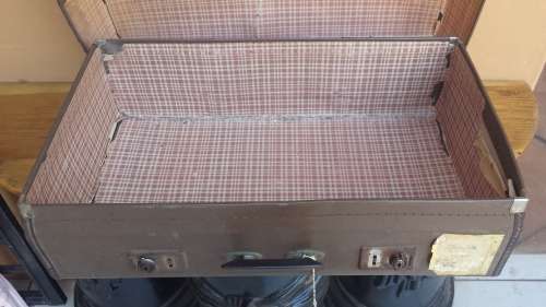 Very old brown expandable suitcase.