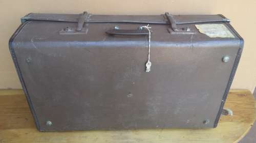 Very old brown expandable suitcase.