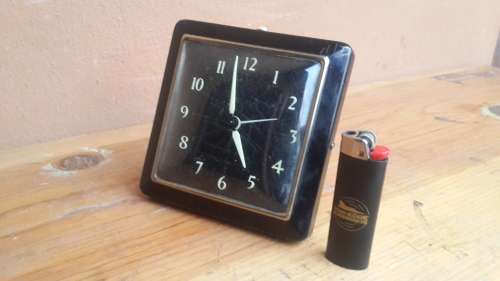 Old black alarm clock.