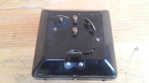 Old black alarm clock.