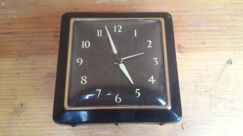 Old black alarm clock.