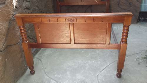 Really old, beautiful wooden double bed.