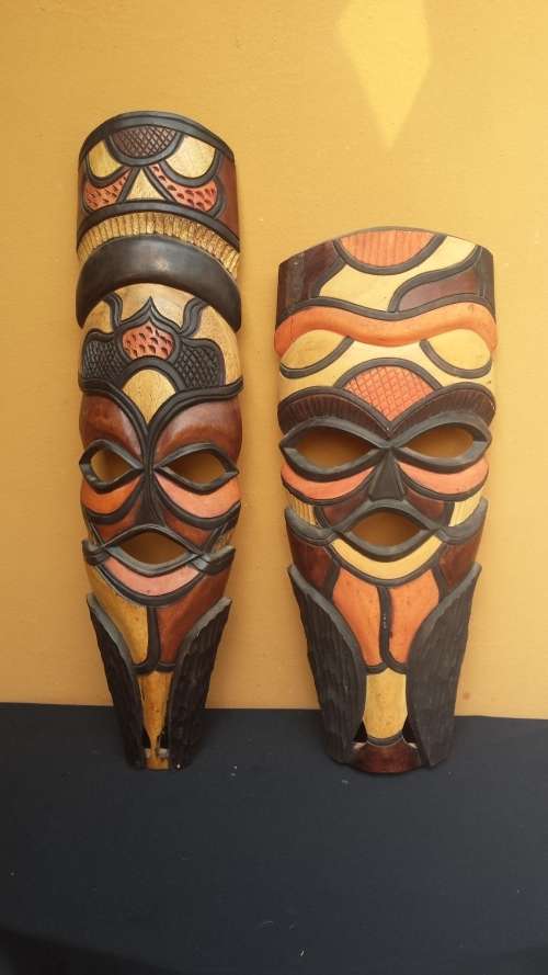 Pair of beautiful colourful wooden masks.