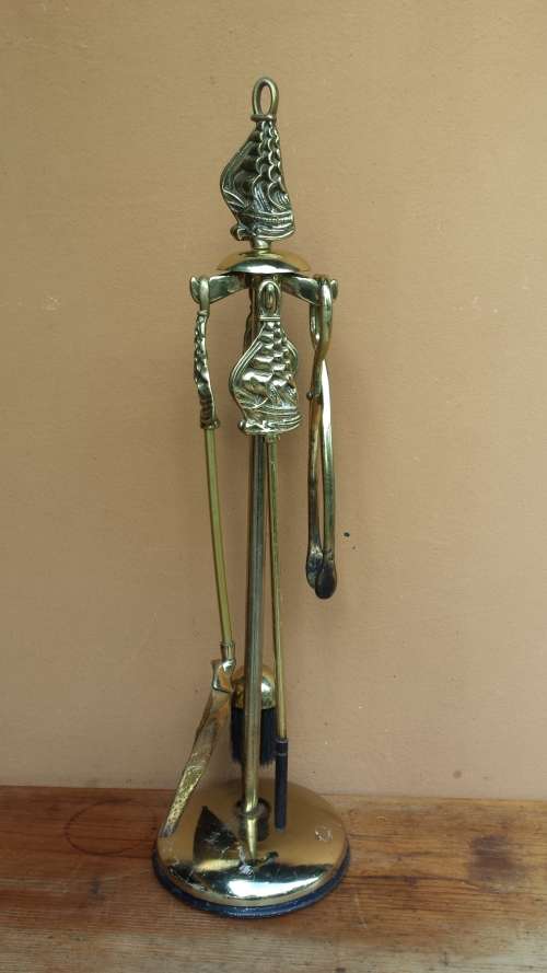 Large brass fire irons.