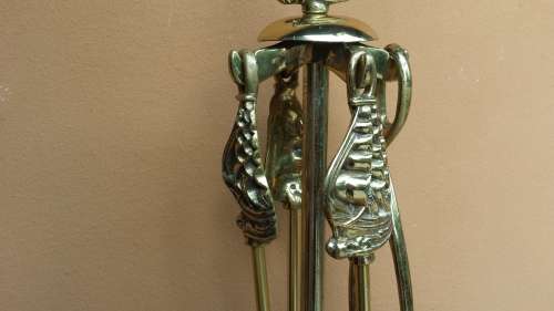 Large brass fire irons.