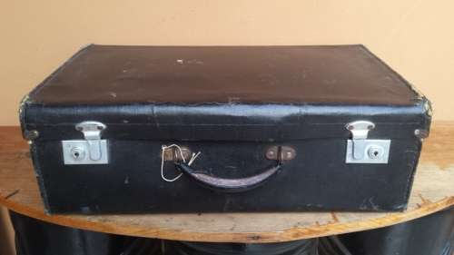 Old black, medium size suitcase.
