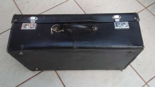 Old black, medium size suitcase.