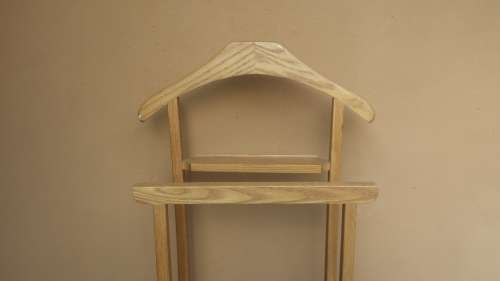 Lovely old wooden suit holder.