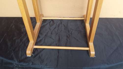 Lovely old wooden suit holder.