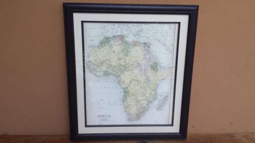 Framed 1876 Africa map by Bartholomew.