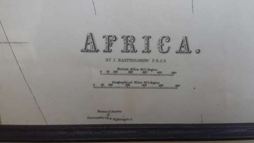 Framed 1876 Africa map by Bartholomew.