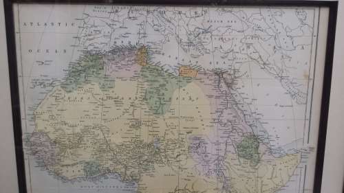 Framed 1876 Africa map by Bartholomew.
